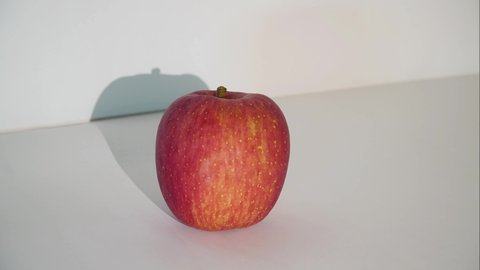 Stop motion peel apple then bite and eating apple, 4k footage video stop motion with multi exposure in motion