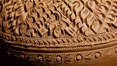 Thai pattern on earthen jar. Thai art engrave pattern on the traditional pottery.