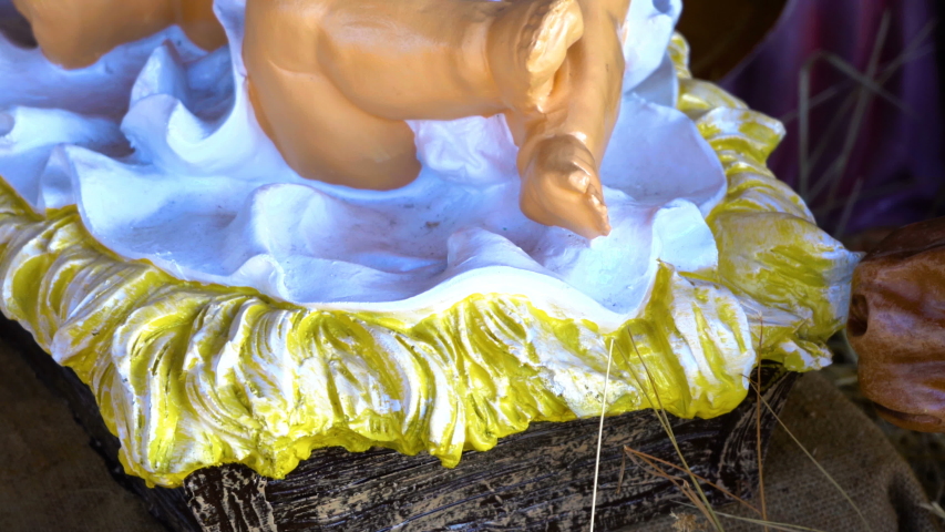 figurine of Jesus in the manger,baby Jesus in the cradle for Christmas close up