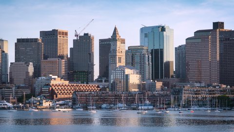 Downtown Boston, Massachusetts, USA: Sunset Time Lapse Skyline of Financial District with Waterfront Reflection. 4K UHD