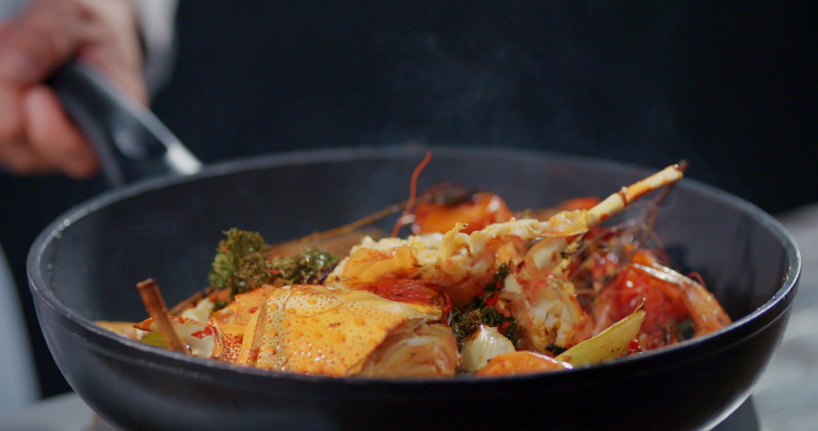 Side View Slow Motion Flambe Shrimp and Crab Shell Royalty-Free Stock Footage #1054890938