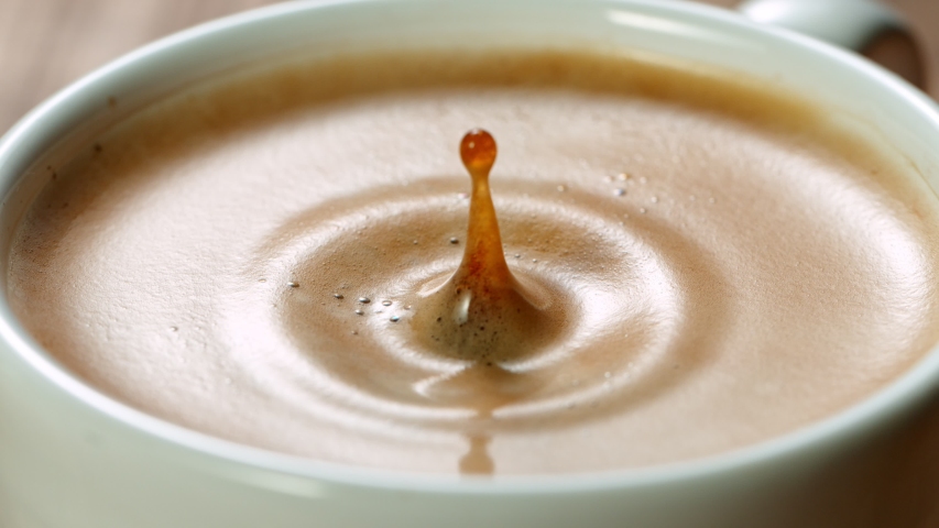 Falling drop into coffee cup, super slow motion at 1000 fps. | Shutterstock HD Video #1054895912