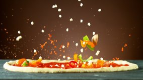 Super slow motion of falling pizza ingredients on yeast dough. Filmed on high speed cinema camera, 1000 fps. - Powered by Shutterstock - Get 15% off with code: PIKWIZARD15