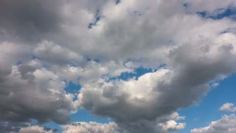 Time lapse clouds, rolling puffy cloud are moving, white lightness clouds time lapse. Cloud running across the blue sky.4k Timelapse of white clouds with blue sky in background.