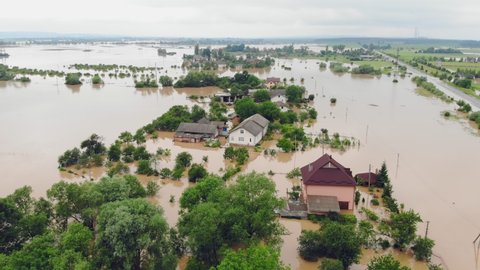 Aerial view Floods and flooded houses. Mass natural disasters and destruction. A big city is flooded after floods and rains.