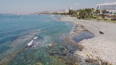 The drone span along the coastline of the city of Limassol.  Lockdown. Empty beach.  Video is recommended to be used as a background.