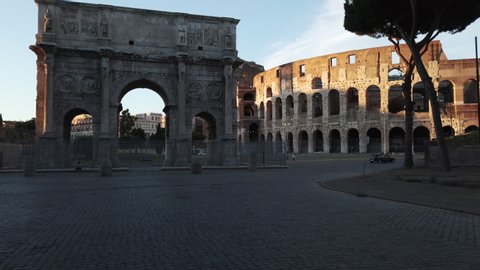sunset on the deserted colosseum square, without tourists due to the lockdown due to the pandemic of the corona virus. Roma Italy during covid emergency