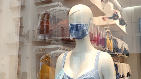a mannequin with a face mask in the window of an underwear store. Madrid, Spain, June 24, 2020.