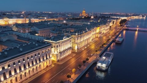 Aerial above St. Petersburg night Winter palace. Downtown historical cityscape. Neva river promenade, old streets, Palace bridge. Saint Isaac's Cathedral, Admiralty. Early morning deserted road nobody