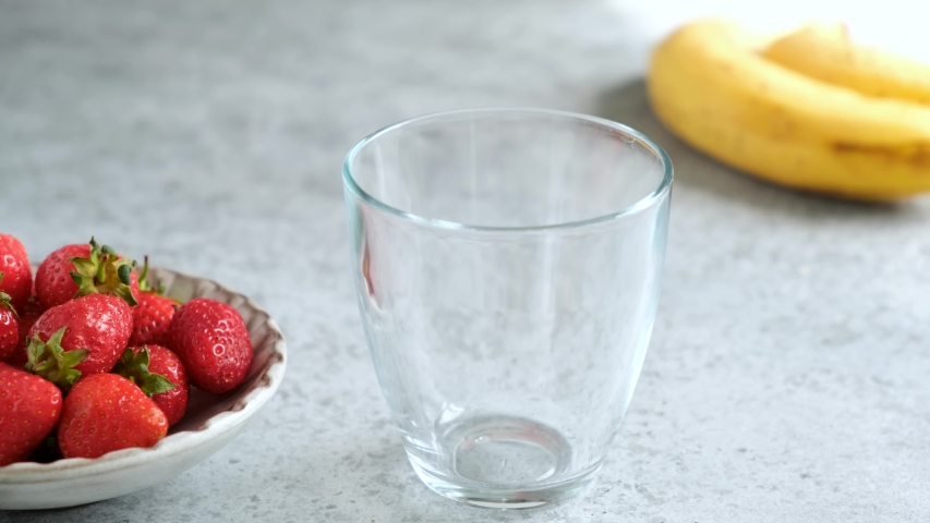 Pouring Delicious Raw Strawberry Smoothie In Glass. Healthy Refreshing Vegan Summer Cocktail Royalty-Free Stock Footage #1054912820