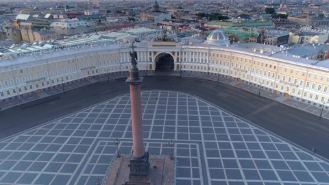 Aerial around epic Alexander Column angel on cross. St. Petersburg Winter Palace early morning deserted square. Historical cityscape downtown. Main headquarters triumphal arch. Travel tourism landmark