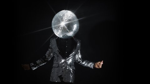 Mr discoball with a mirror ball as a head in nightclub disco dancing against a black background