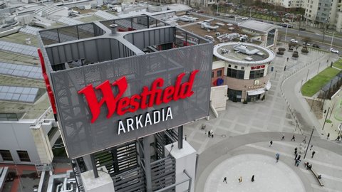 Warsaw, Poland - April 5th 2020: Westfield Arkadia shopping centre by roundabout "Zgrupowania AK Radosław" in Warsaw. Aerial view of big shopping mall in Europe. Popular meeting place.