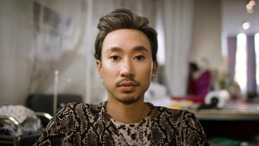 Stylish fashion designer portrait. Handsome and authentic creative portrait. Asian man shot in slow-motion and in 4k.  | Shutterstock HD Video #1054921745