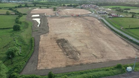 Aerial film over agricultural land cleared for housing development