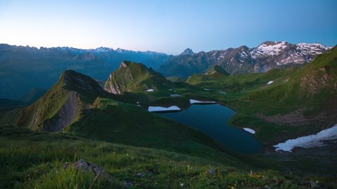 Timelapse of a sunrise over a heart-shaped lake in the Pyrenees