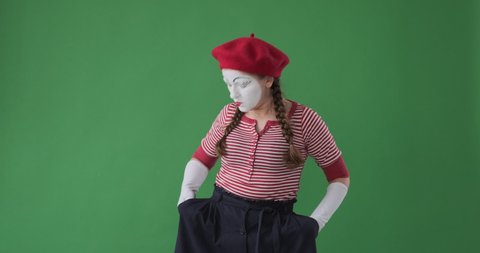 Confused mime artist checking pockets finding loss of her stuff 