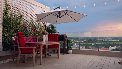 cozy rooftop patio with beautiful city view on sunset