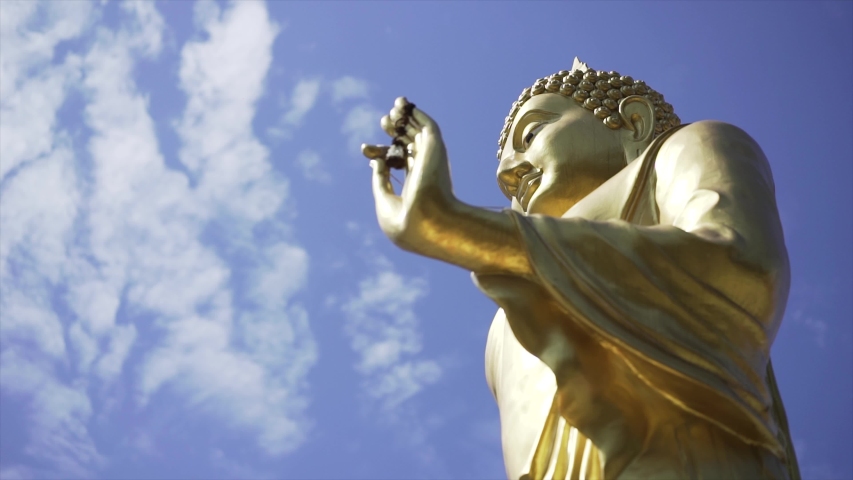 Filming a video of the Buddha corner facing the sky Royalty-Free Stock Footage #1054946324