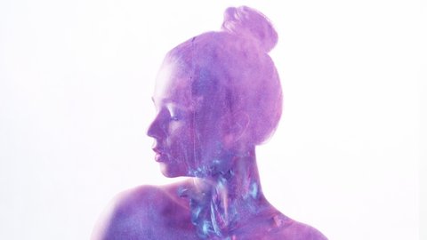 Fantasy portrait. Spiritual beauty. Purple paint splash in woman silhouette double exposition isolated on white.