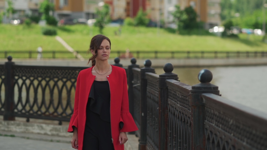 Pretty fashionable woman on the city street