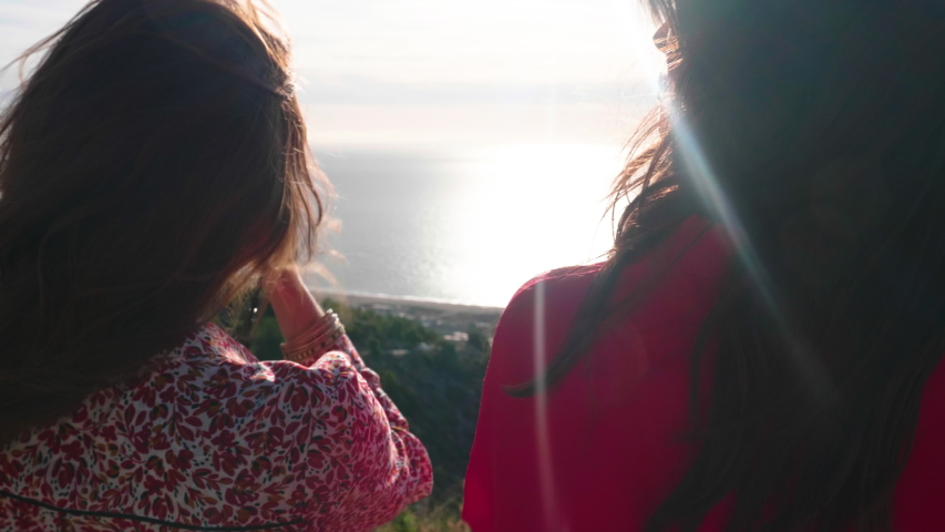 Woman taking pictures of the horizon