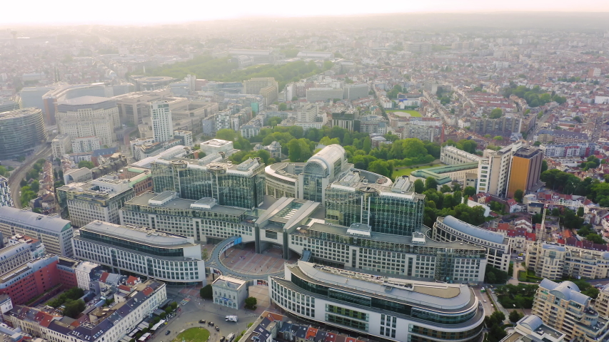Inscription on video. Brussels, Belgium. The complex of buildings of the European Parliament. State institution. Glitch effect text, Aerial View, Point of interest