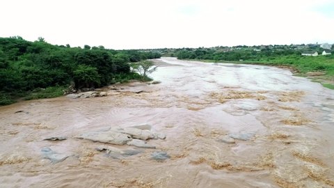 Aerial view of the raging Kaiti river that drains into the Athi River which drains into the Indian Ocean. The Kaiti river is found in Makueni, Kenya
