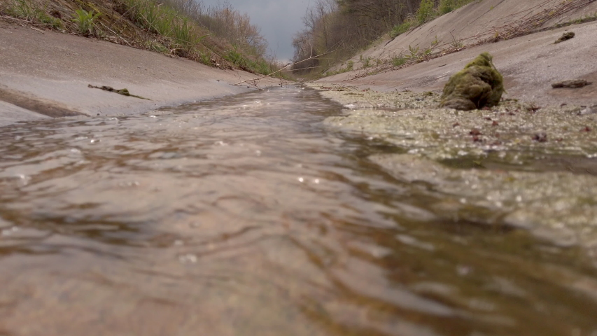 Dolly up over a diversion channel.