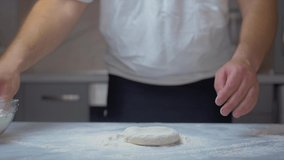 man kneads the dough.Beautiful view.