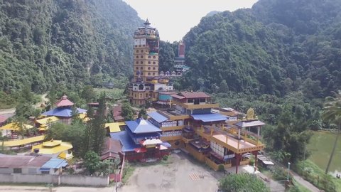 Perak Tambun Tibetian Temple, also known as Jingang Jing She by the locals, of luscious valleys, orchards and limestone hills (aerial photography)