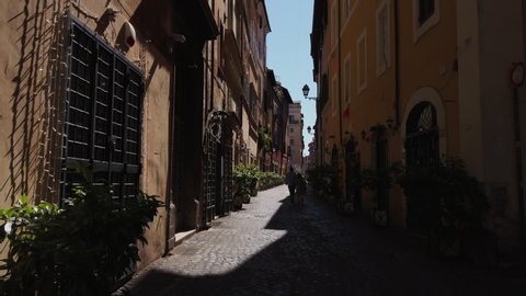 4K. Streets of Rome symbol of Dolce vita. historic buildings in pastel colors. sunny summer day. narrow alleys and squares. Trastevere's streets