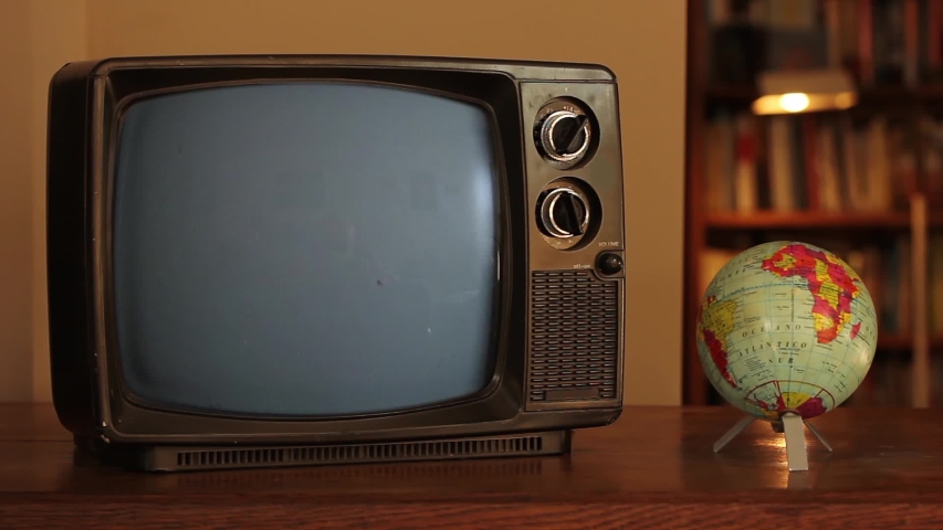 Clenched Fist Symbol on a Retro TV and World Globe Map. Black Lives Matter and Revolution Concept. Close Up.  