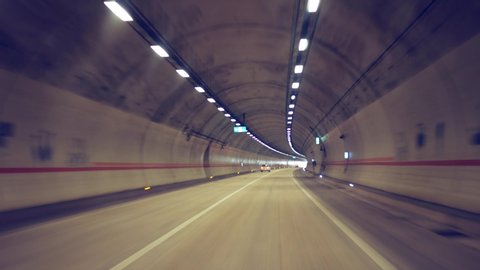 pov view of drive at high speed through the tunnel to the light