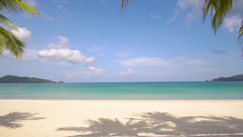 Phuket beach sea sand and sky. Landscape view of beach sea in summer day. Beach space area. At Karon Beach, Phuket, Thailand. On 25 June 2020. 4K UHD. Video Clip