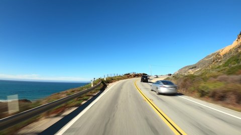 Back view driving in Big Sur California Highway nr 1