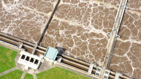 Aerial view to sewage treatment plant. Grey water recycling. Waste management theme. Ecology and environment in European Union.