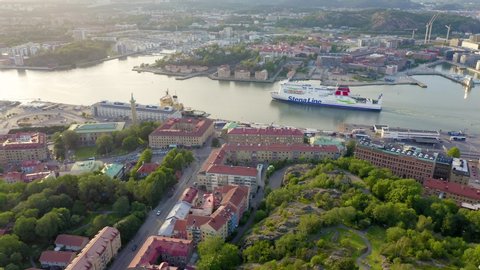 Gothenburg, Sweden - June 25, 2019: StenaLine ferry passes along the river. Panorama of the city and the river Goeta Elv, Aerial View, Departure of the camera