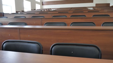 Bottom To Top View Of Desks In Empty Lecture Hall, Classroom, Auditorium. 