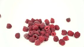 red ripe raspberry fall on white background, set of raspberries on white, slow motion footage