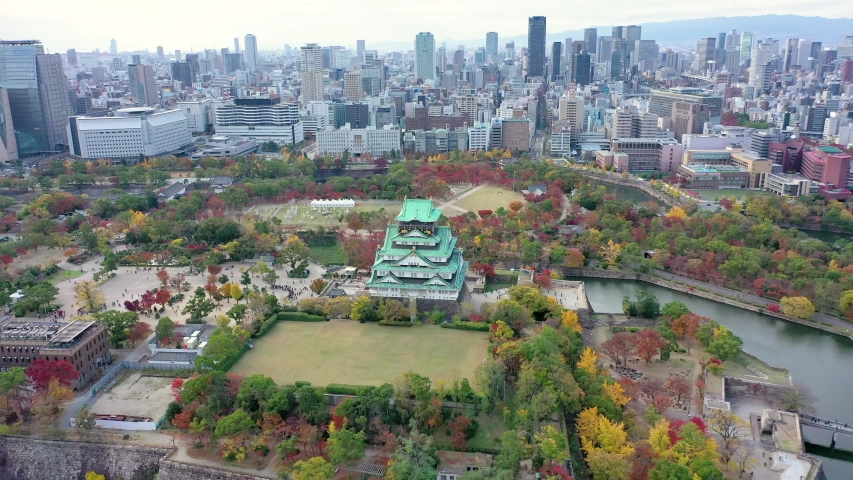 Aerial view 4k by drone of Osaka castle and building city at Osaka, japan in autumn. Royalty-Free Stock Footage #1055103290