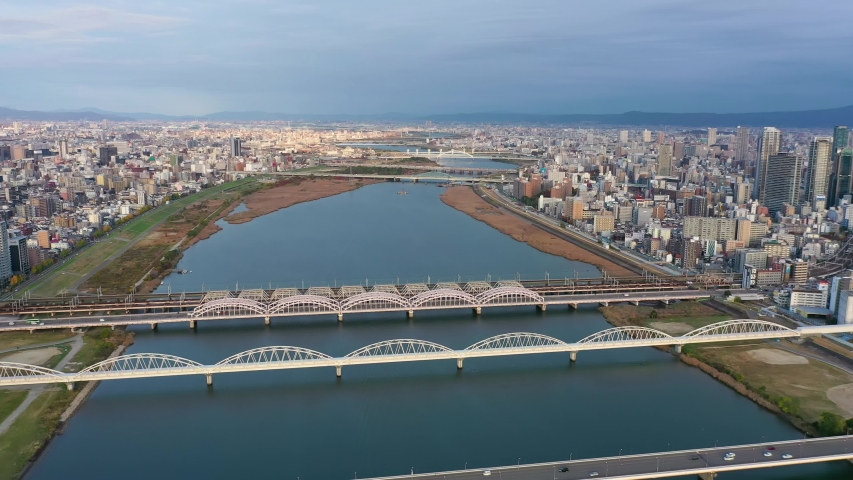 Aerial view 4k video by drone of River and building in Osaka city, Japan. Royalty-Free Stock Footage #1055103296
