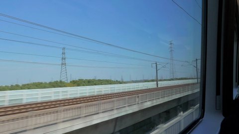 Chinese high speed train. View outside window of High Speed Train driving at 350 km/h
