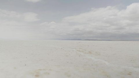 Man Walking in Salar de Uyuni, amid the Andes in southwest Bolivia, is the world’s largest salt flat.