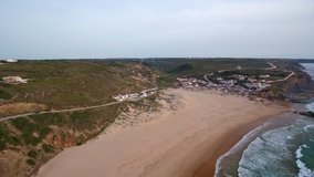 Aerial video shooting. Monte Clerigo surf beach on the Atlantic coast. Portugal, Aljezur, Sagres, Algarve.