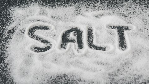 Sprinkling table salt on kitchen counter top