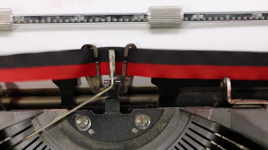 writing on the vintage typewriter the text VINTAGE on the white sheet