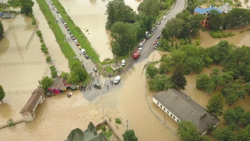 The flooded city of Halych from a height. Flood in Ukraine 06.24.2020. The Dniester River overflowed due to heavy rainfall and flooded houses and roads. Aerial video Royalty-Free Stock Footage #1055119025