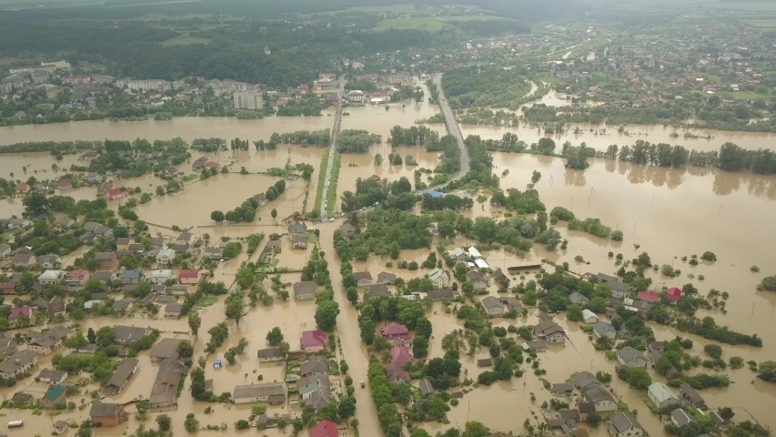 The flooded city of Halych from a height. Flood in Ukraine 06.24.2020. The Dniester River overflowed due to heavy rainfall and flooded houses and roads. Aerial video Royalty-Free Stock Footage #1055119028