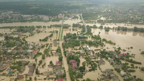 The flooded city of Halych from a height. Flood in Ukraine 06.24.2020. The Dniester River overflowed due to heavy rainfall and flooded houses and roads. Aerial video